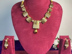 LuxeAlankar Designer Gold Plated Statement Necklace Set with American Diamond Detailing and Matching Earrings