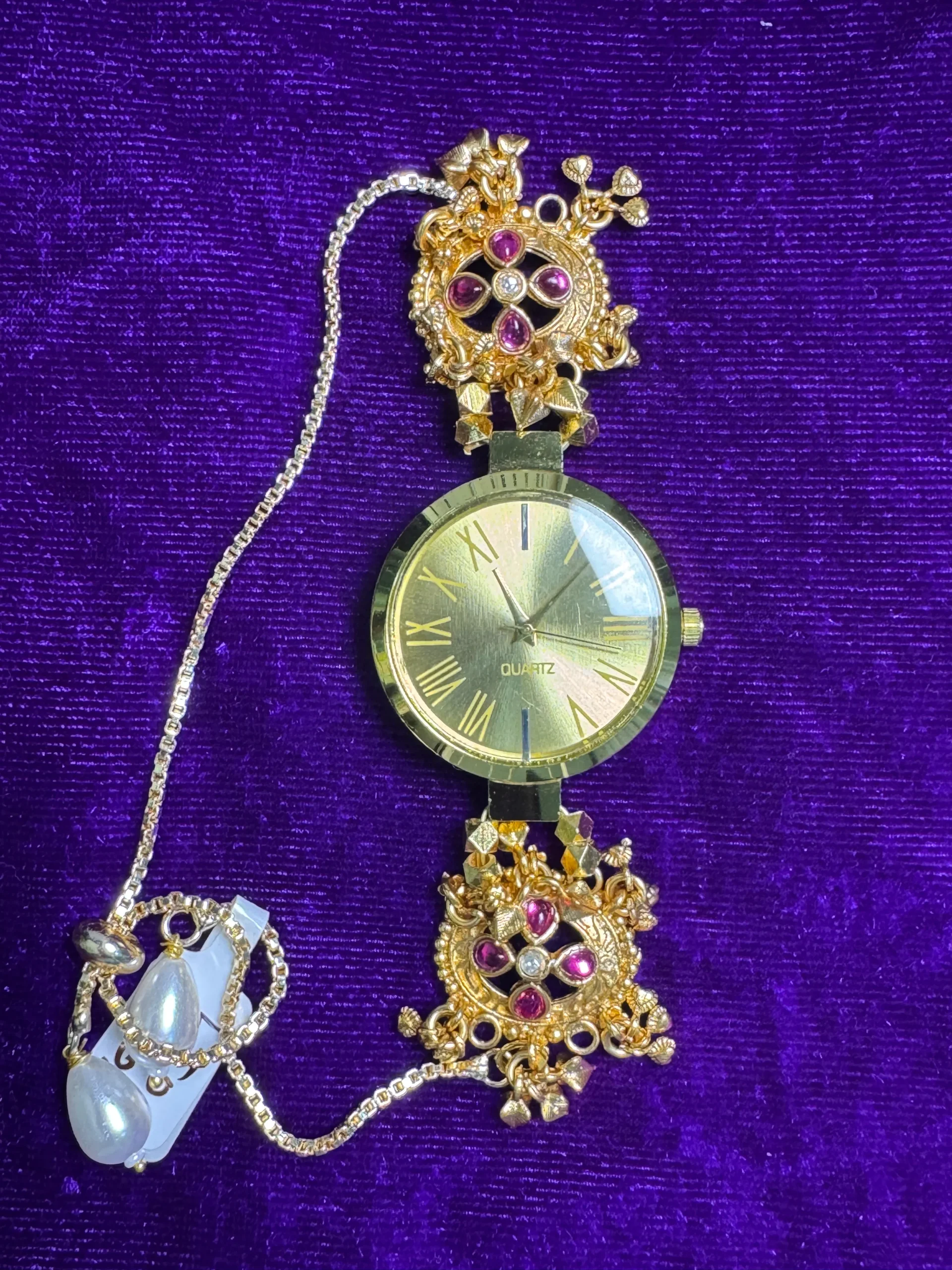 luxealankar heritage floral gold plated bracelet watch with ruby stones LuxeAlankar Heritage Floral Gold Plated Bracelet Watch with Ruby Stones for Women